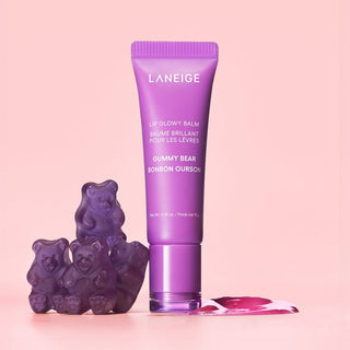 Purple Laneige lip balm with gummy bear-shaped containers on a pink background