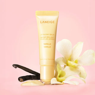 Laneige lip balm with vanilla beans and flowers on a pink background