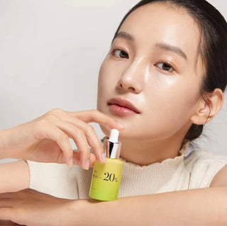 Anua Vitamin C 20 Blemish Serum in a clear bottle with a white pump, showcasing a bright, clean design for skincare.