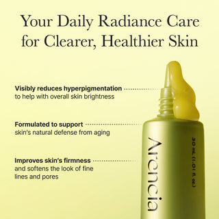 Arencia Vitamin C Booster Shot 30ml in a clear glass vial with orange label, showcasing the bright liquid inside.