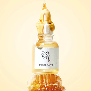 Beauty of Joseon Glow Serum with Propolis and Niacinamide, featuring a sleek glass bottle with dropper for brightening skincare.