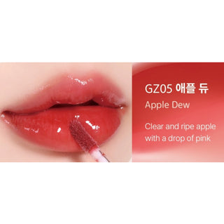 Black Rouge Chewy Lip Glaze lipstick in Peach Blossom, showcasing a smooth black tube with a glossy peach-colored cap.