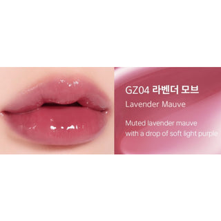 Black Rouge Chewy Lip Glaze lipstick in peach blossom shade, with a smooth, glossy finish and sleek black packaging.