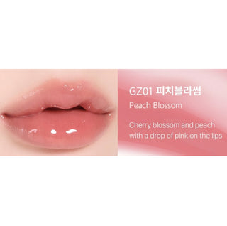 Black Rouge Chewy Lip Glaze lipstick in Peach Blossom, featuring a sleek black tube with the product name visible.