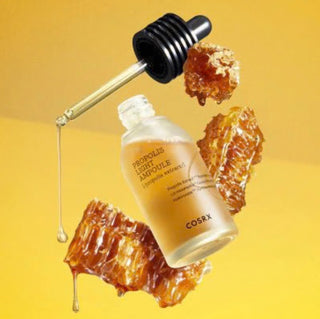 CosRX Full Fit Propolis Light Ampoule serum in a clear glass bottle with dropper, featuring a minimalist label and white cap.