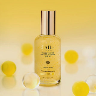 D'Alba White Truffle First Oil Capsule Serum in a 100ml bottle, featuring a sleek glass container with a dropper cap.
