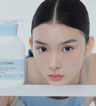 Illiyoon Ceramide Ato Lotion 350mL, a moisturizing lotion with ceramides, shown in a clear bottle with a pump dispenser.