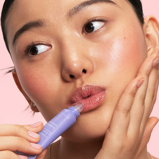 Laneige Lip Glowy Balm in packaging, featuring a sleek tube design, part of the 5-type collection for nourishing lip care.