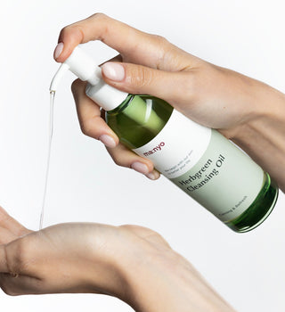 ma:nyo Herb Green Cleansing Oil bottle with green label and pump dispenser, 200ml size, for gentle facial cleansing
