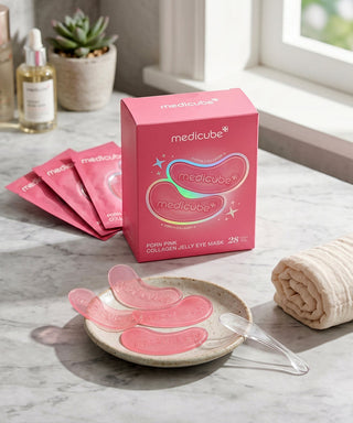 Medicube PDRN Pink Collagen Jelly Eye Mask pouch, showing the eye mask package with pink and purple design and product branding.