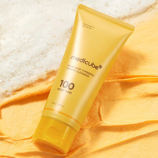 Medicube Kojic Acid Tumeric Toning Facial Cleanser 120g bottle with label and cap, designed for brightening and cleansing skin.