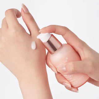 Medicube Triple Collagen Serum 4.0 in 55mL bottle, showing the serum and cream texture with the product label visible.
