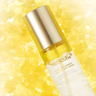 Medicube Kojic Acid Turmeric Vita Jelly Mist Serum in a 100ml bottle, showing the clear serum inside and the product label.