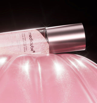 Medicure PDRN Pink Collagen Glow Jelly Mist Serum in a 100mL bottle, showing the pink, gel-like serum with a spray nozzle.