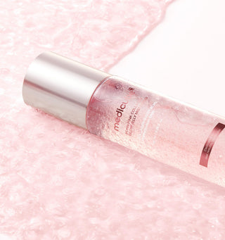 Medicube PDRN Pink Collagen Glow Jelly Mist Serum in a 100mL bottle, featuring a pink, hydrating, and illuminating skincare formula.