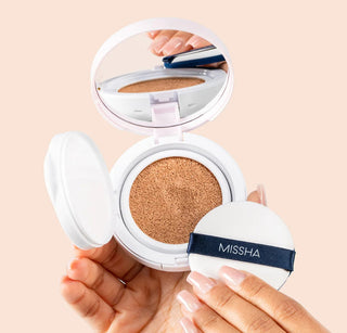 MISSHA Magic Cushion Cover Lasting foundation in 15g, close-up of the compact with open sponge applicator and smooth, beige foundation.