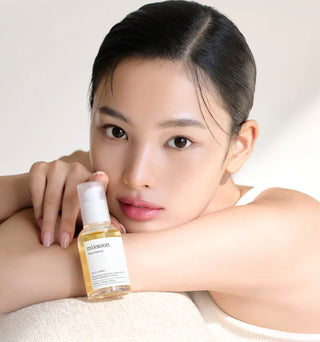 Mixsoon Bean Essence in a 30ml bottle, showing the clear liquid and label, designed for skincare hydration and nourishment.