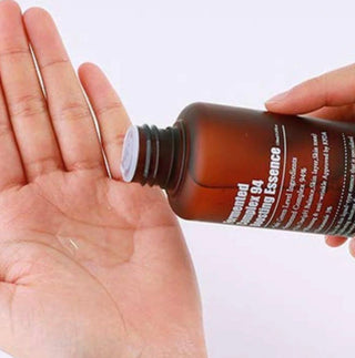 Purito Seoul Fermented Complex 94 Boosting Essence in a clear bottle, highlighting natural ingredients and skincare benefits.