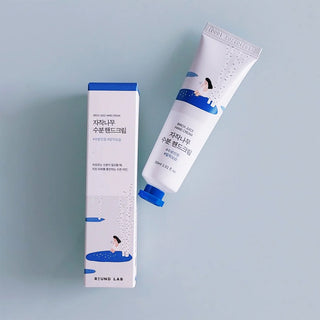 Cream container labeled ROUND LAB Birch Juice Hand Cream 30ml, showcasing the product's packaging and design.