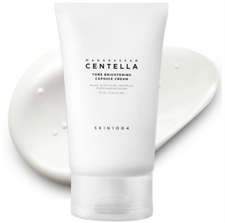 Skin1004 Madagascar Centella Tone Brightening Capsule Cream moisturizer in a jar, showcasing its smooth, brightening skincare formula.