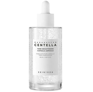 Skin1004 Madagascar Centella Brightening Capsule Ampoule serum in a 30ml bottle with a dropper cap.