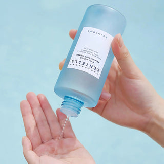 Skin1004 Madagascar Centella Hyalu-Cica Brightening Toner in a 30ml bottle, featuring clear liquid and minimalist label design.