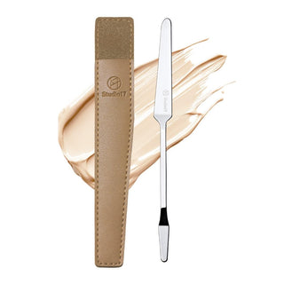 Studio 17 makeup spatula with a sleek handle and flat blade, ideal for precise application and mixing cosmetic products.