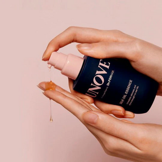 Unove Silk Oil Essence 70ml bottle for hair with warm petal scent, smooths and nourishes hair with lightweight oil.