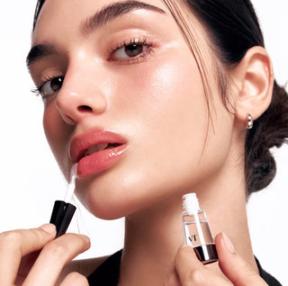 VT Cosmetics Reedle Shot Lip Plumper in three shades, showcasing glossy, full lips with a sleek tube and vibrant colors.